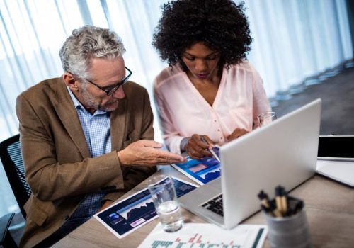 two-businessmen-working-on-a-computer-2025-04-05-06-04-05-utc